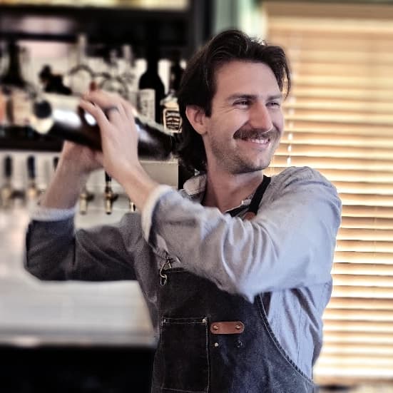 Chase Nelson bartending