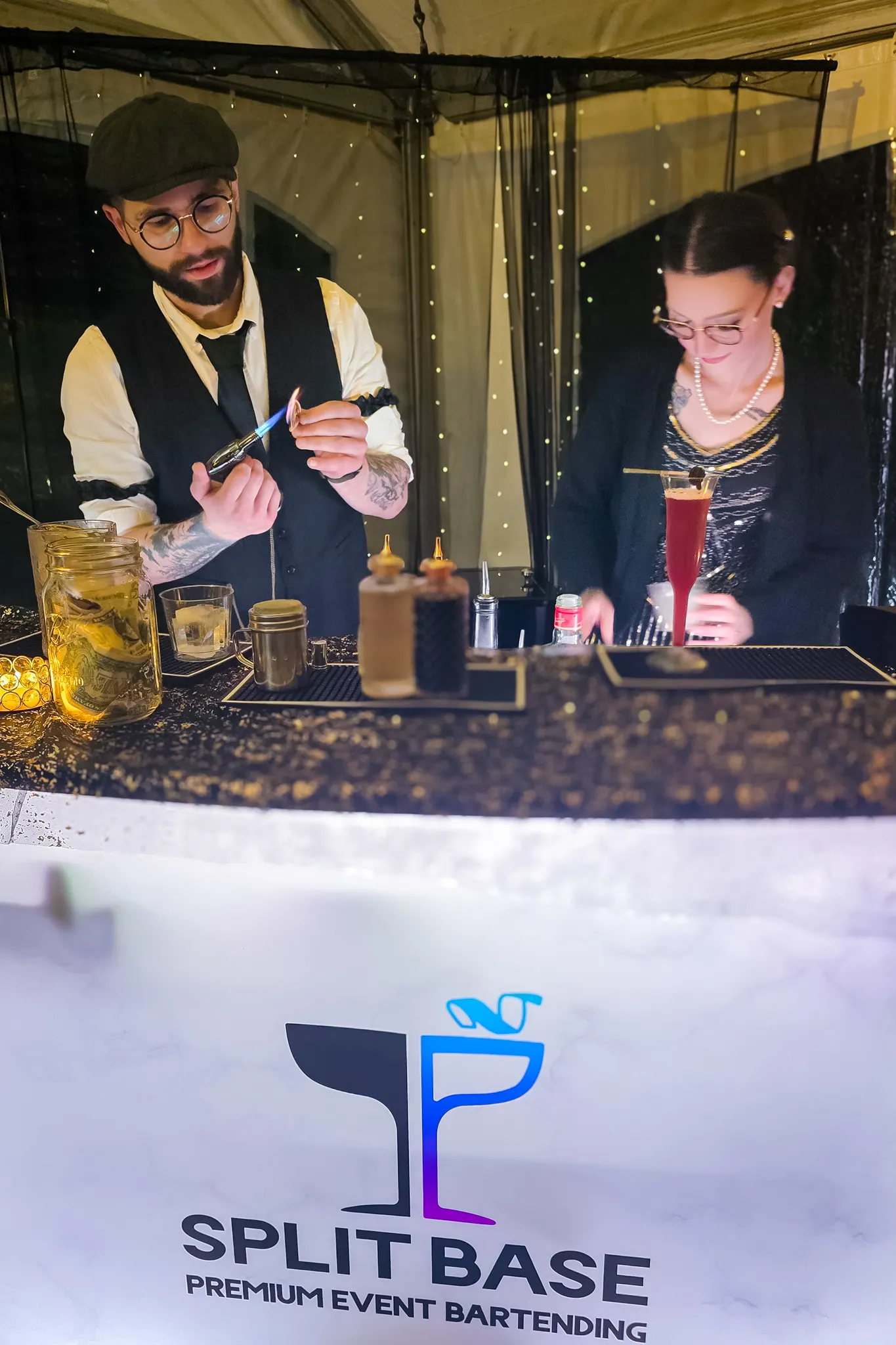 Bartender garnishing a cocktail behind a gold-accented bar