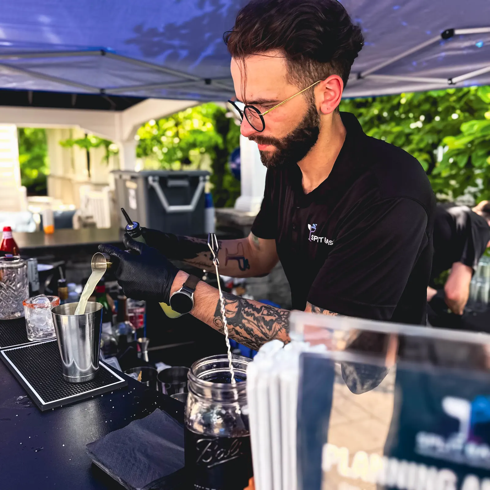 Measured jigger pour mid-build at the backyard bar